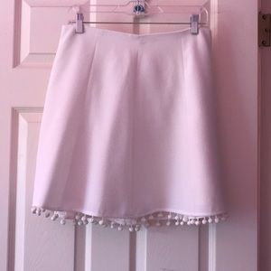 White skirt with Pom Pom detailing